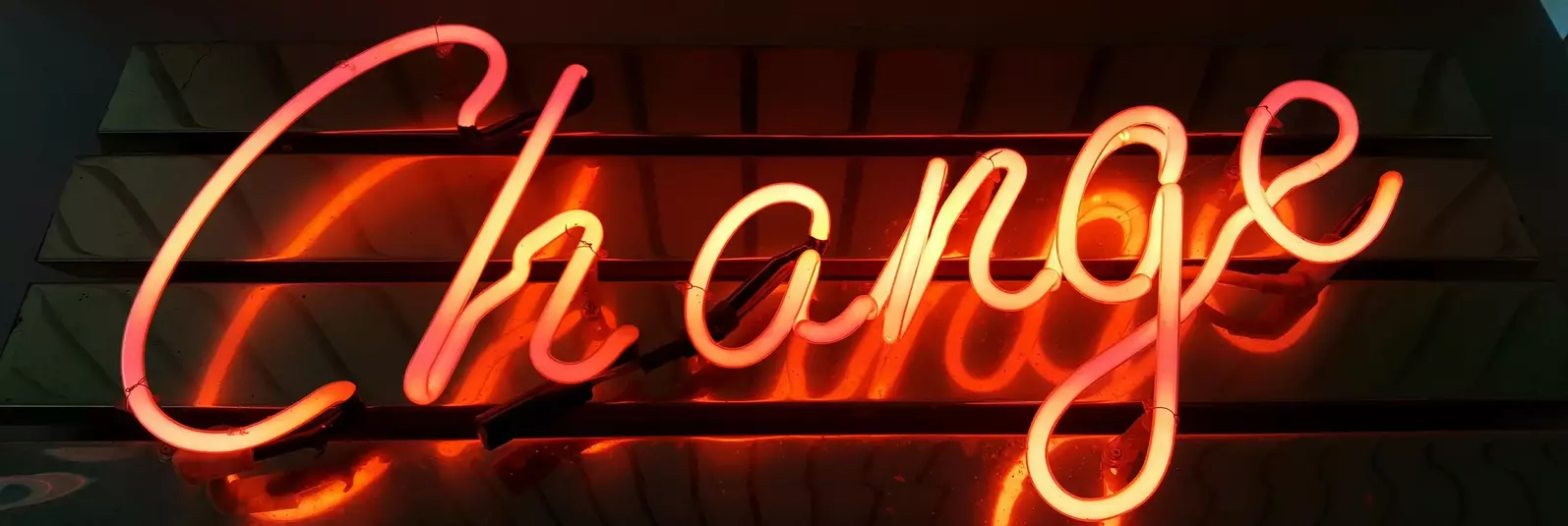 Neon sign which reads 'change'